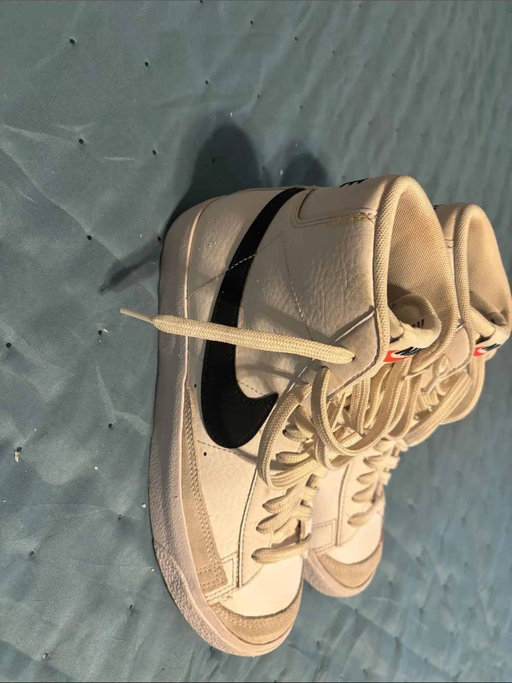 Nike White High-Top Sneakers with Black Swoosh